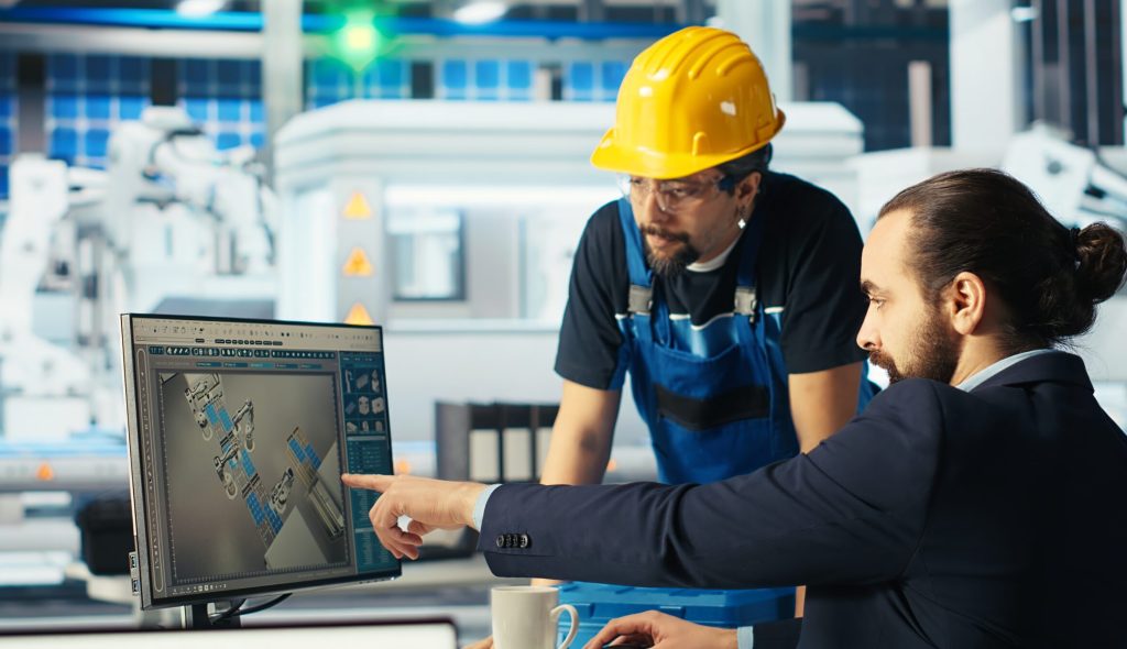 photovoltaics factory researcher telling worker how to improve efficiency